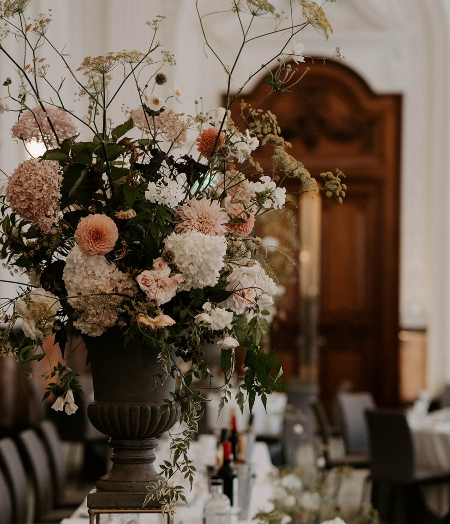 Elegant wedding flowers in a stone vase